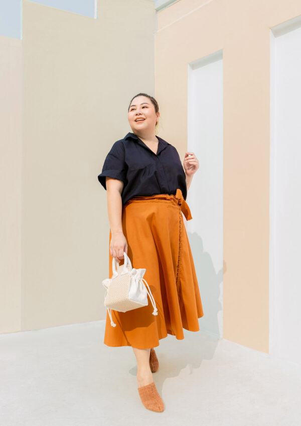 Plus size woman wearing orange cotton skirt and shirt