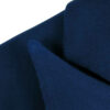 Detail of dark blue blazer made from organic cotton