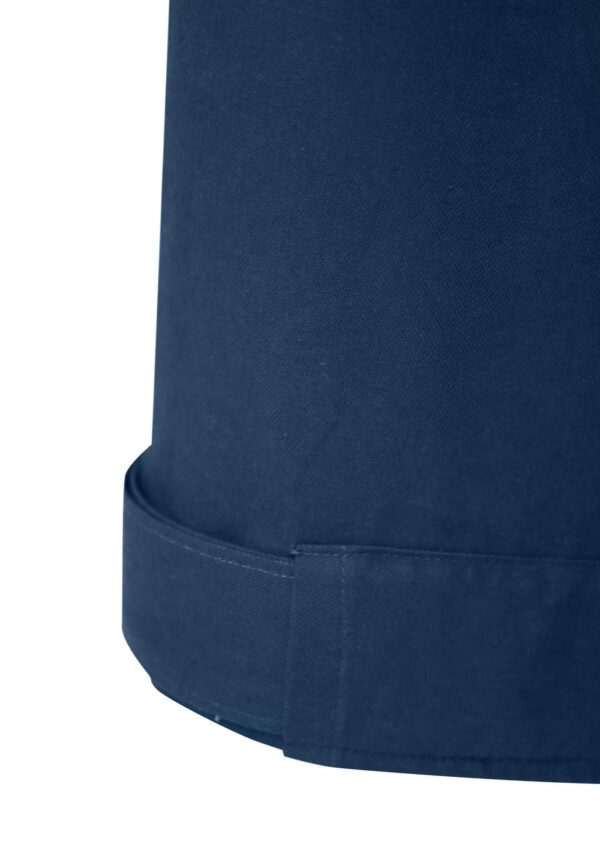 Detail of oversized dark blue trousers made from sustainable cotton